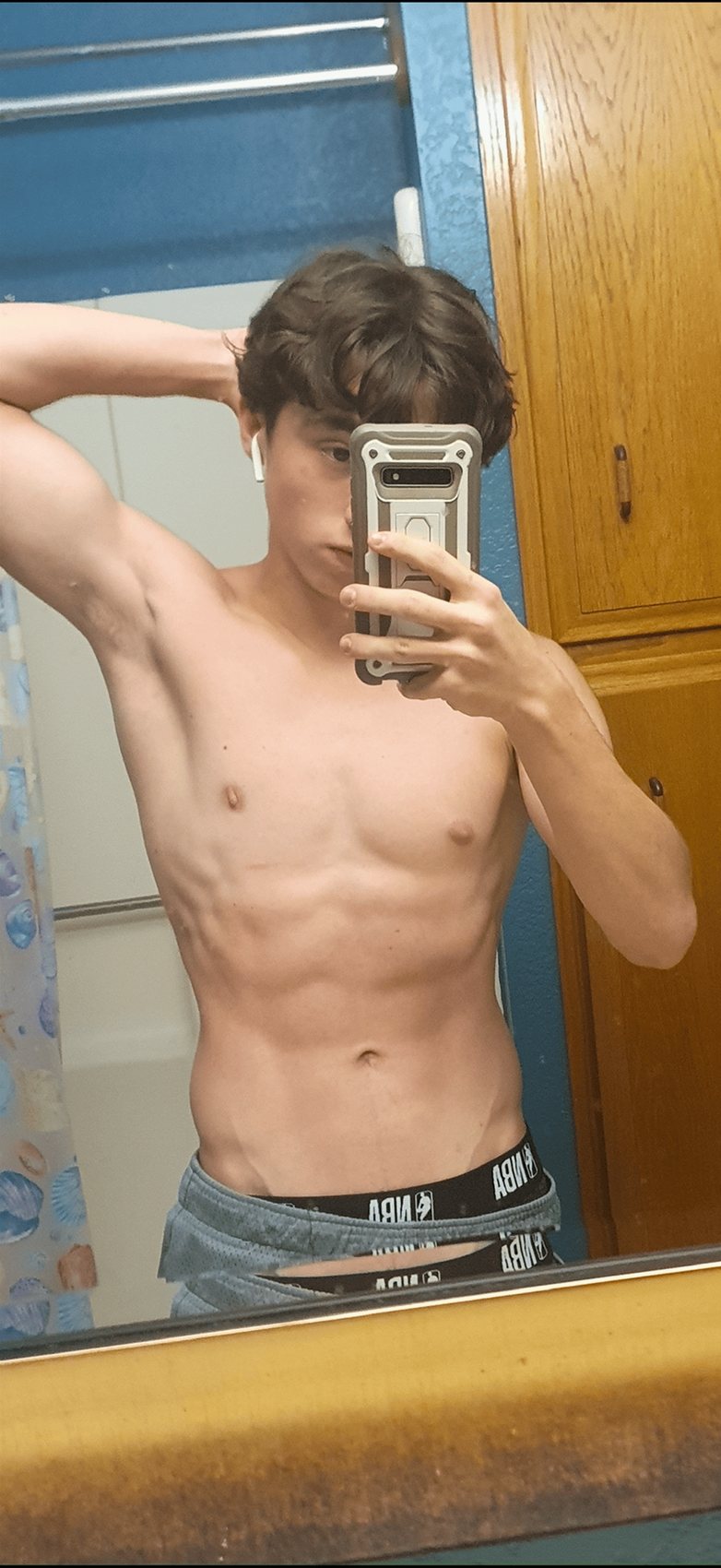 Skinny teenager before photo, lean build before starting home calisthenics